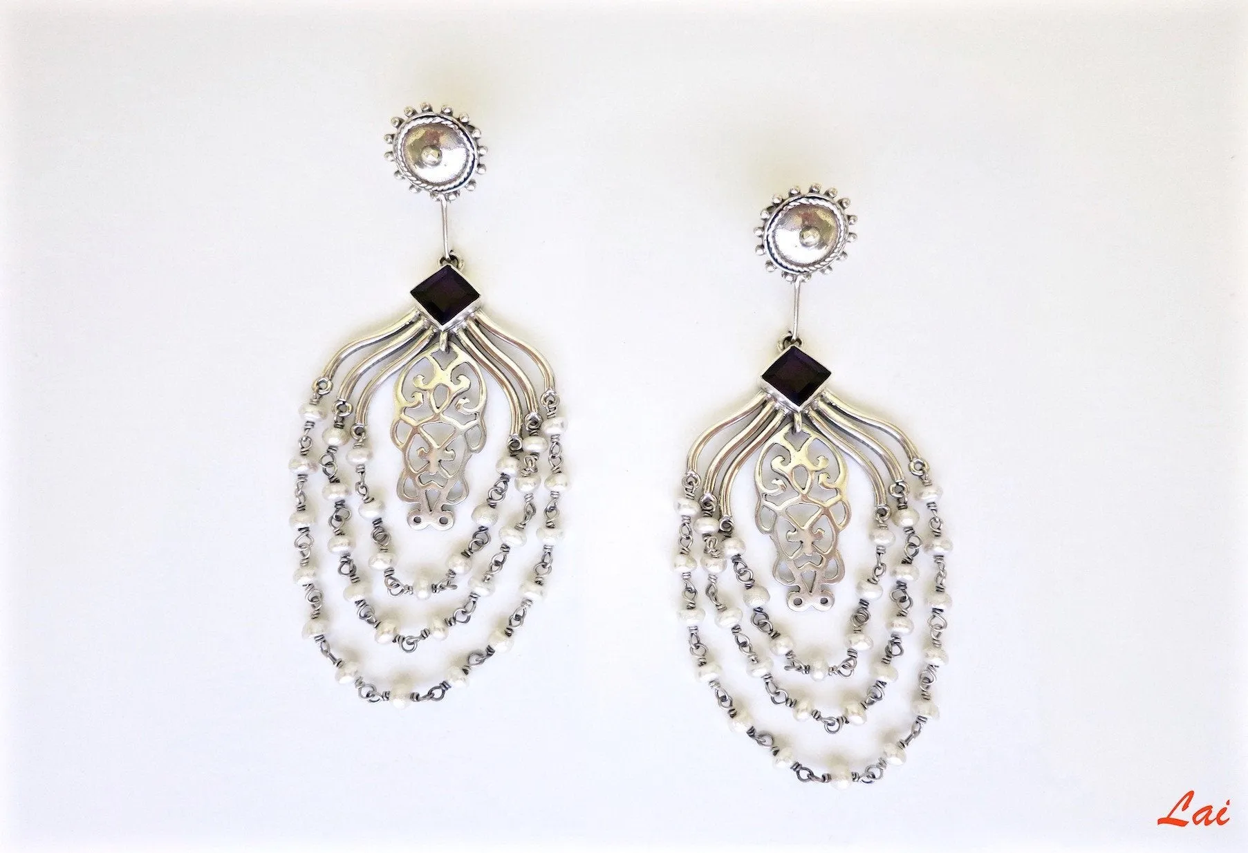 Chic, draping pearls chandelier earrings