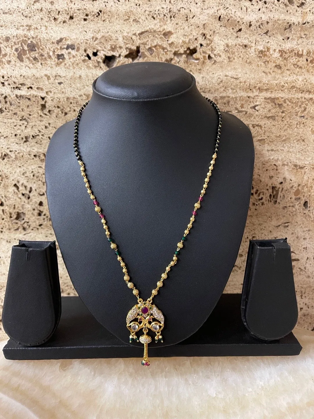 Modern Stylish Short Mangalsutra Designs AD Peacock Pendant With Latkan Gold And Black Beads Chain