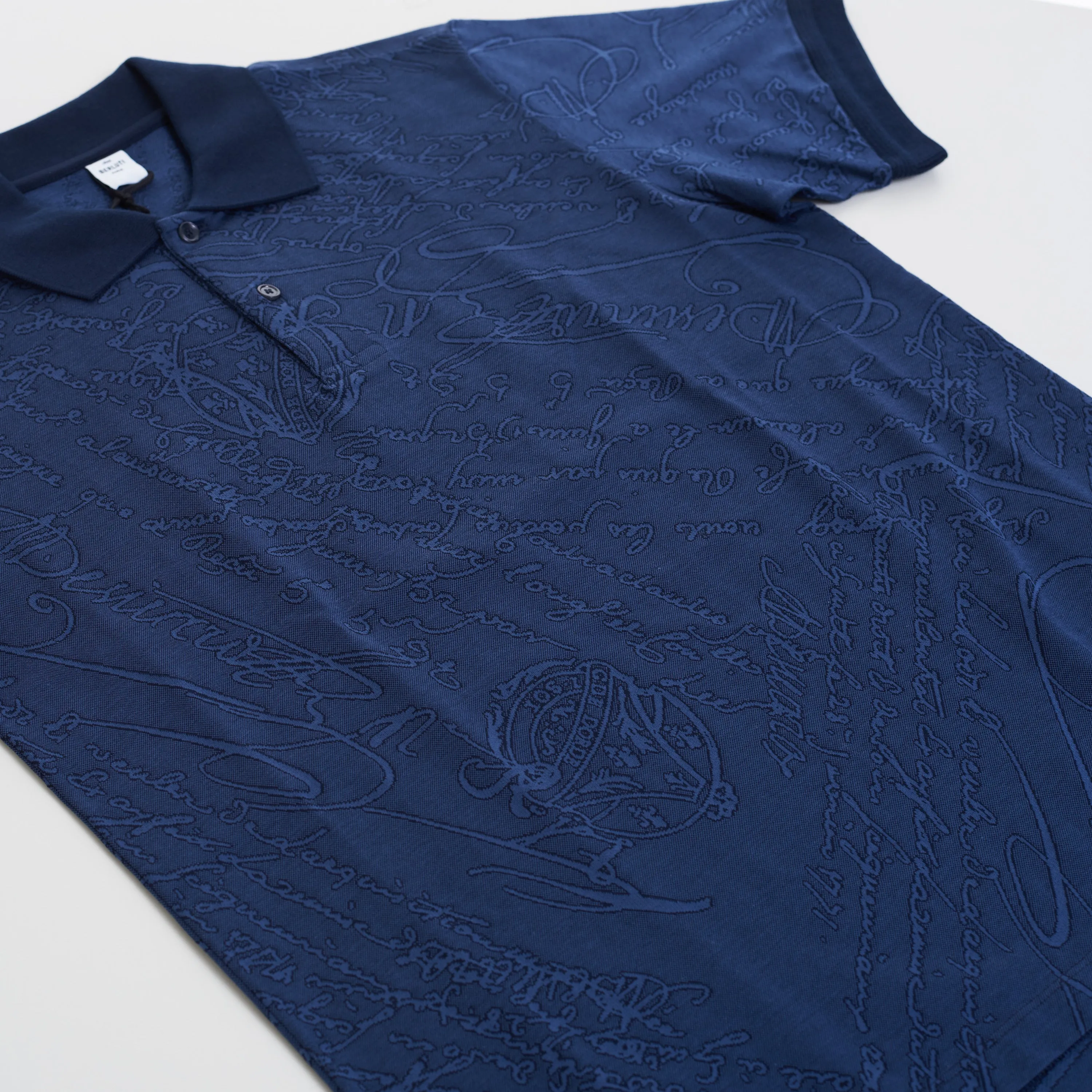 Polo-Shirt In Warm Blue All Over Scritto Jacquard Cotton