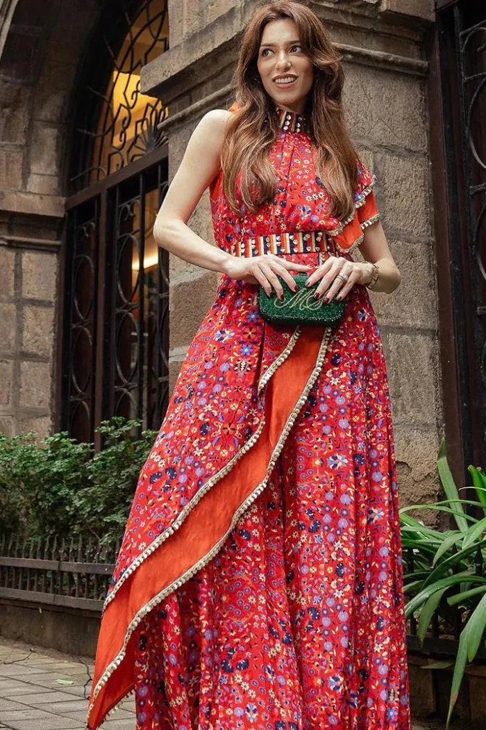 RED CROP TOP WITH ATTACHED DRAPE OF LEAF PRINT AND RED JAAL PRINT WITH BLUE SHARARA PANTS WITH EMB BELT
